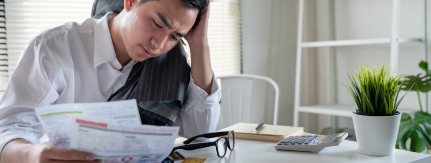 stressed man with debt