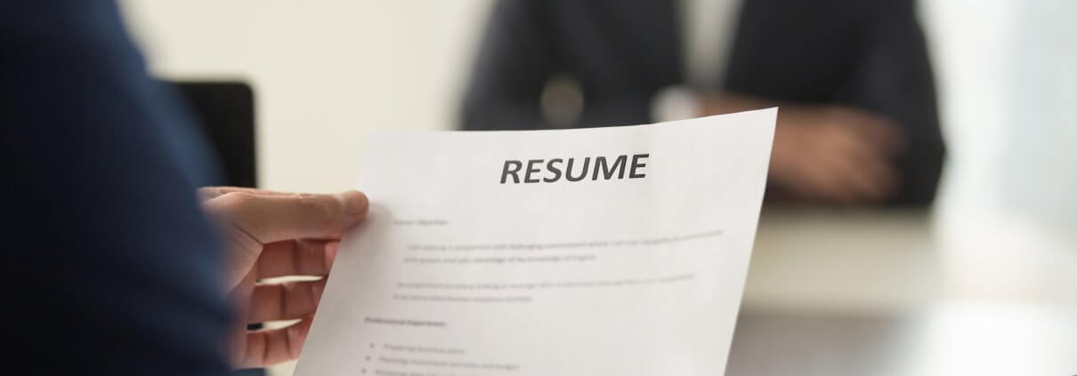 person holding a resume