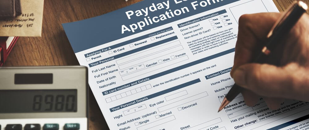 someone filling out a payday loan application