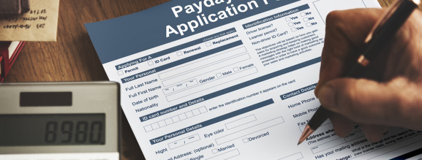 someone filling out a payday loan application