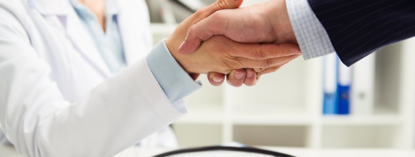healthcare professionals shaking hands