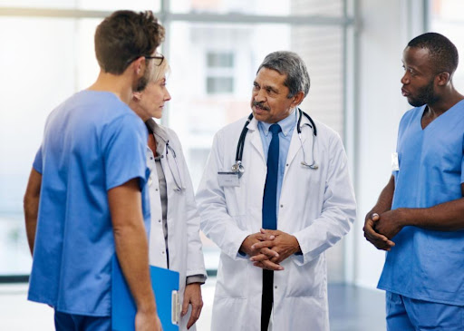 doctors speaking with one another