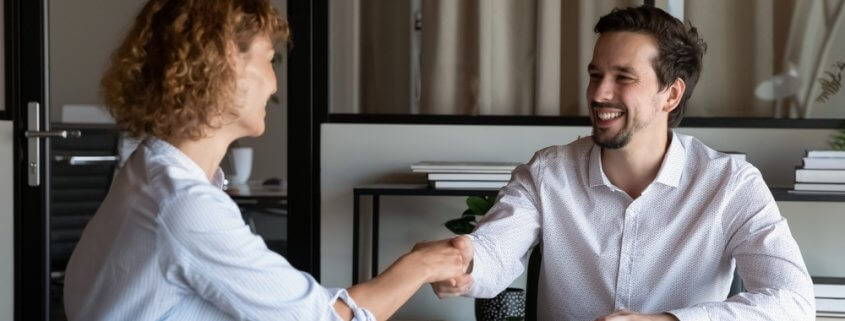 staffing agency owner shaking hands with someone else
