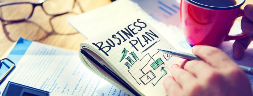 business plan written on a notepad
