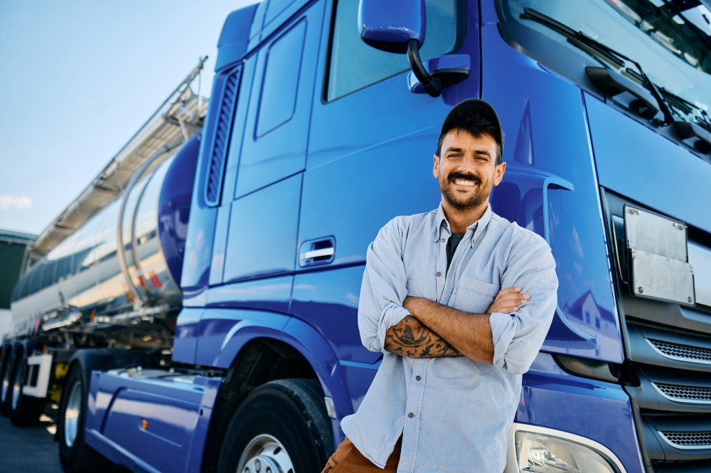 trucking business owner in front of truck